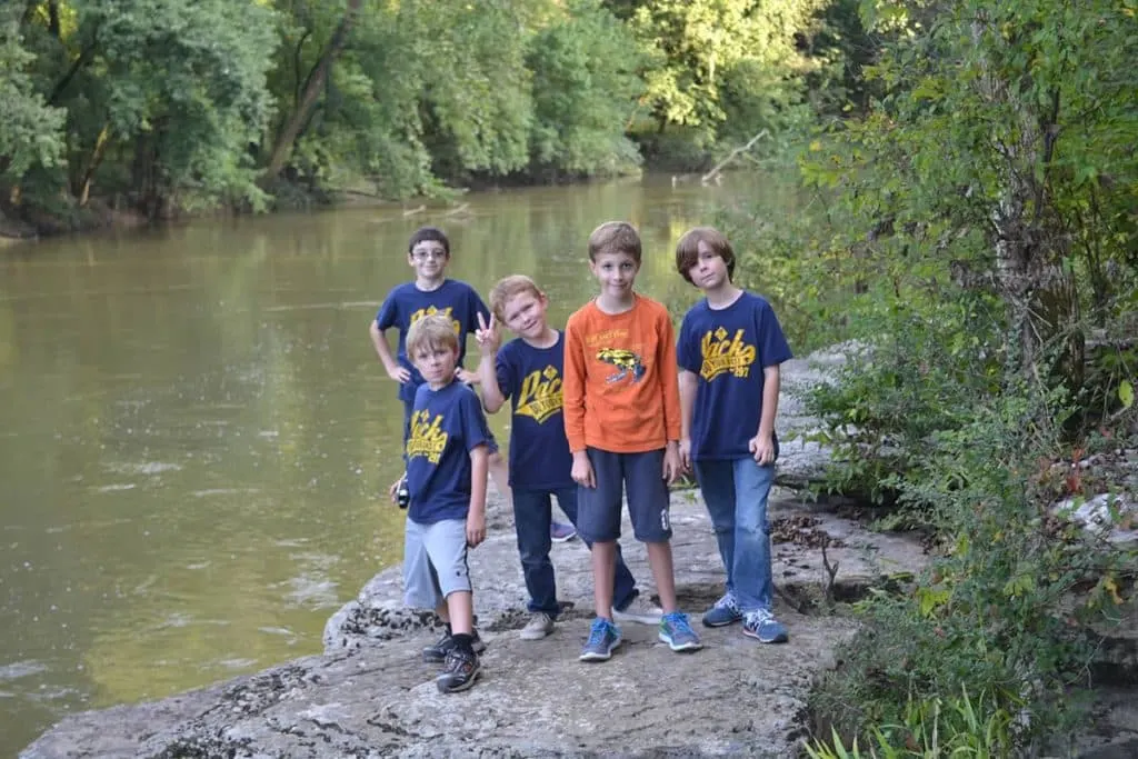 cub scouts outdoors by creek