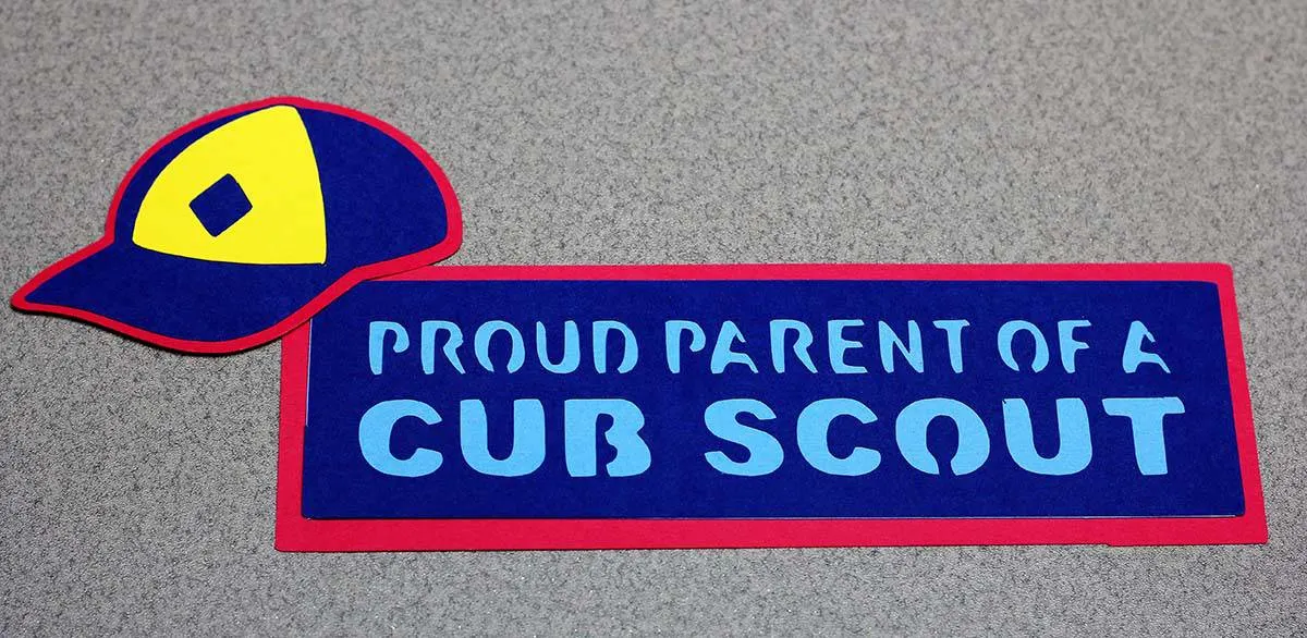 Cub Scout hat and proud parent sign made with Cricut