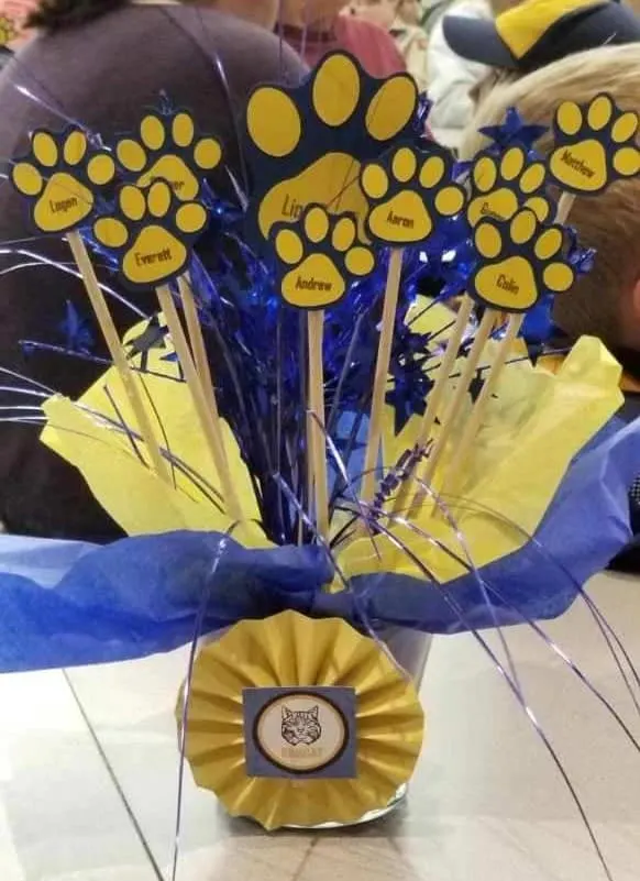 blue and gold centerpieces with names