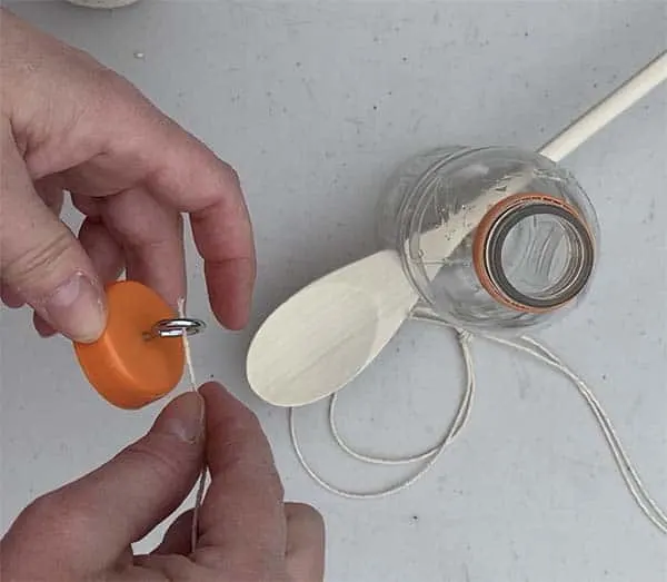 plastic bottle bird feeder string through eye hook